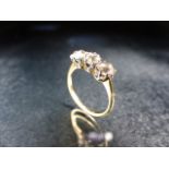18ct Gold Three stone Diamond ring. Three Old Cut Diamonds approx .33 ct each set in white gold size