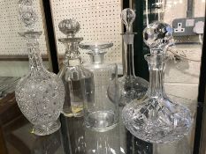 Group of five cut glass decanters with stoppers