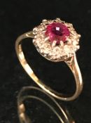 18ct yellow gold and platinum set ruby and diamond ring of daisy style