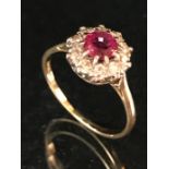 18ct yellow gold and platinum set ruby and diamond ring of daisy style