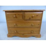 Low pine chest of four drawers