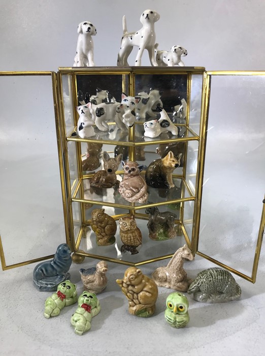 Collection of ceramic animals in a three tier metal display case (height 75cm)