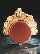 A Victorian 9ct gold and bloodstone set swivel fob pendant, having engraved decoration, gross weight