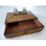 Walnut writing box with original glass ink wells mounted to the lid and a carved bust separating the
