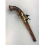 Flintlock long barrelled pistol with carved chequered grip, unusual barrel (approx 32cm) with