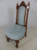 Single high-backed bedroom chair with pale blue upholstery