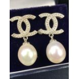 Pair of silver and CZ designer-style earrings with pearl drops