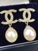 Pair of silver and CZ designer-style earrings with pearl drops