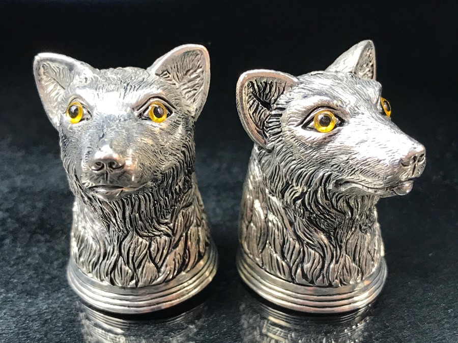 Pair of silver plated condiments in the form of dogs with glass eyes