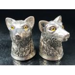 Pair of silver plated condiments in the form of dogs with glass eyes