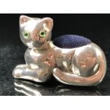 Silver cat pin cushion with emerald eyes