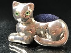 Silver cat pin cushion with emerald eyes