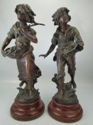 Pair of bronzed spelter figures signed L & J Moreau