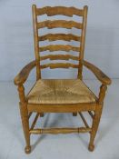 Rush-seated ladderback armchair