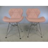 Pair of retro-style pink chairs with chrome legs