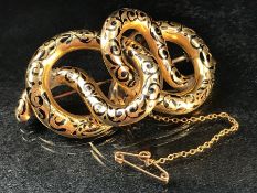 Gold coloured metal double headed snake brooch with 'C' clip and safety chain. tests as high carat