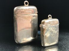 A Silver hallmarked match striker and one other