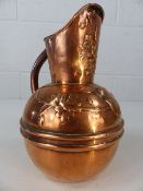 Copper jug, the top half embossed with birds and trees approx. 22cm tall