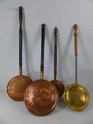 Three copper and one brass bed pans