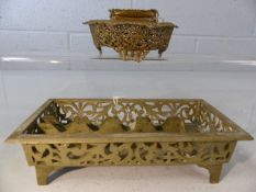 Ornate metalwork inkwell and brass desk tidy