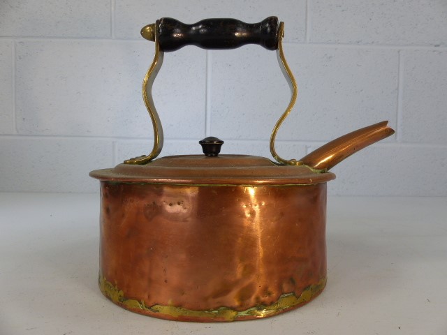 Copper kettle with turned wooden handle