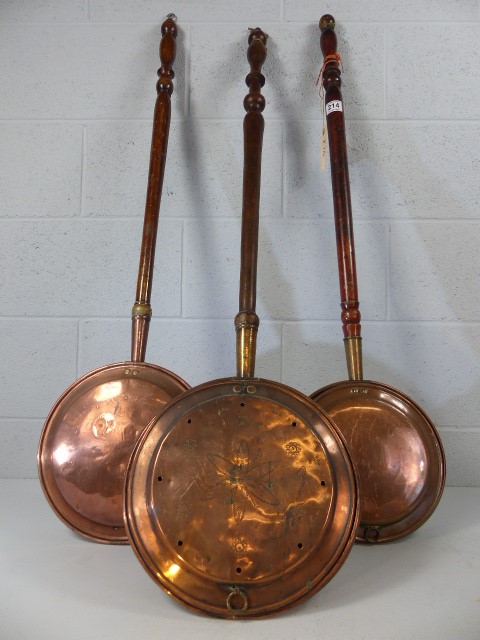 Three brass bed pans