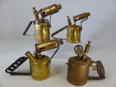 Collection of four brass parafin lamps