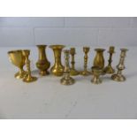 Collection of miniature brass candlesticks and vases