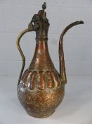 Brass and copper Middle Eastern coffee pot with all-over decoration