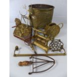 Collection of brass items to include fire dogs, towel rails etc.