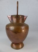 Copper twin spout jug with fixed handle and single foot approx. 41cm tall