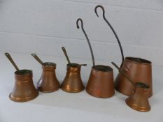 Collection of six copper Cider and Spirit warmers