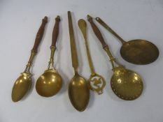 Collection of brass kitchen utensils