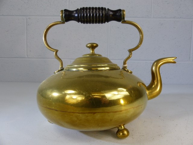 Brass teapot on three bun feet