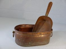 Small copper planter and copper shovel