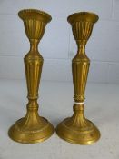 Two small brass candlesticks approx 15cm tall