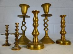 Three pairs of brass candlesticks, height of largest approx. 14cm