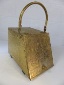 Brass coal scuttle with embossed decoration