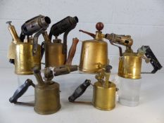 Six brass paraffin lamps