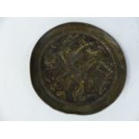 Circular brass raised depiction of a Roman scene. Approx. 18cm in diameter