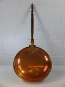 Brass and copper bed pan with turned wooden handle