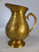 Brass jug with floral decoration