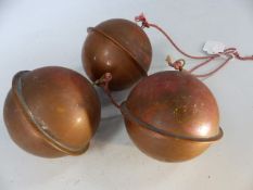 Three hollow copper balls