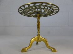 Brass kettle / pot stand on tripod feet with horse decoration to centre