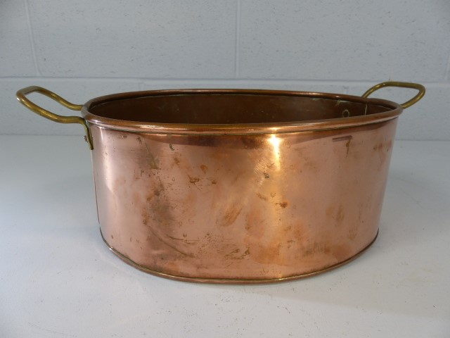 Oval copper cooking pan with brass handles