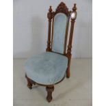 Single high-backed bedroom chair with pale blue upholstery
