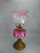 Victorian oil lamp with pink floral design, complete with shade and chimney