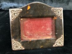 Tortoise shell picture frame with silver mounts depicting hearts and Cherubs (14cm x 12cm) A/F