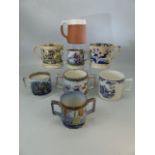 A collection of mostly 19th century transfer-printed pottery cider mugs, three twin-handled