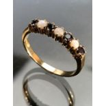 9ct Gold ladies ring set with small Opals and Garnets size R